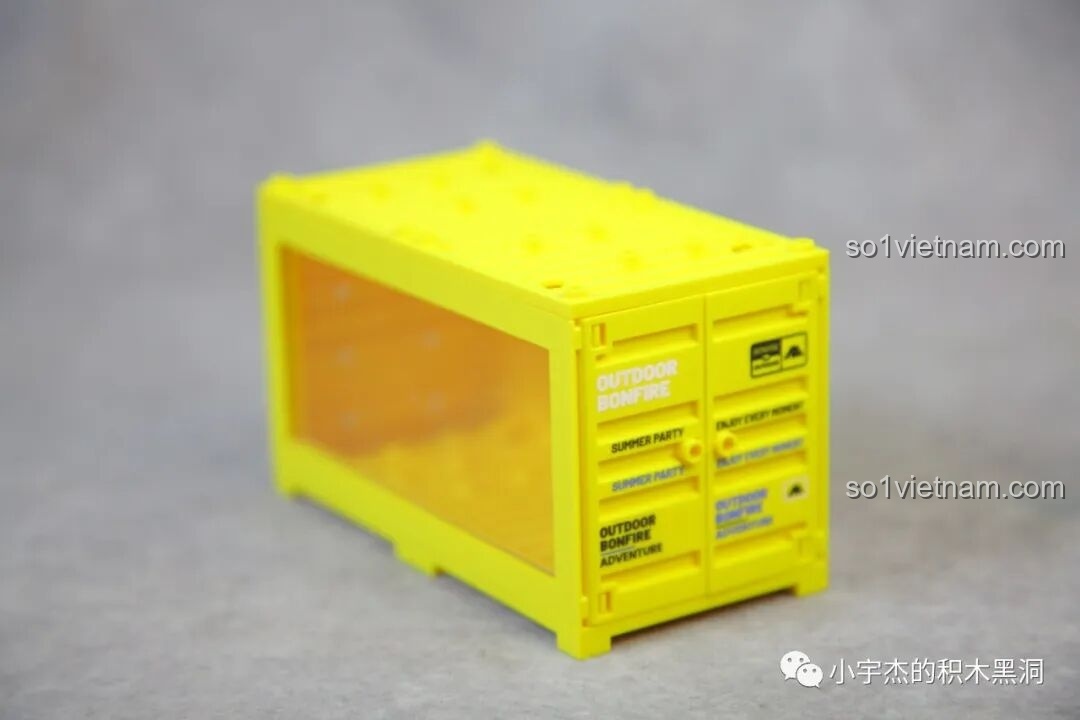 Mặt bên của container màu vàng Sembo 714509 với chữ 'BAEE' và 'OUTDOOR BONFIRE' được in lớn.