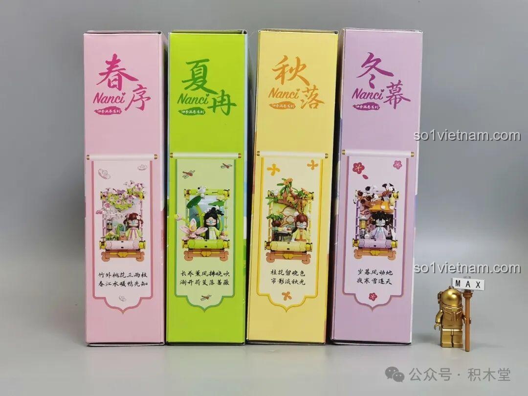 Một góc nhìn khác về bốn hộp đồ chơi Nanci Bốn Mùa, làm nổi bật tên của từng mùa được viết bằng thư pháp nghệ thuật.