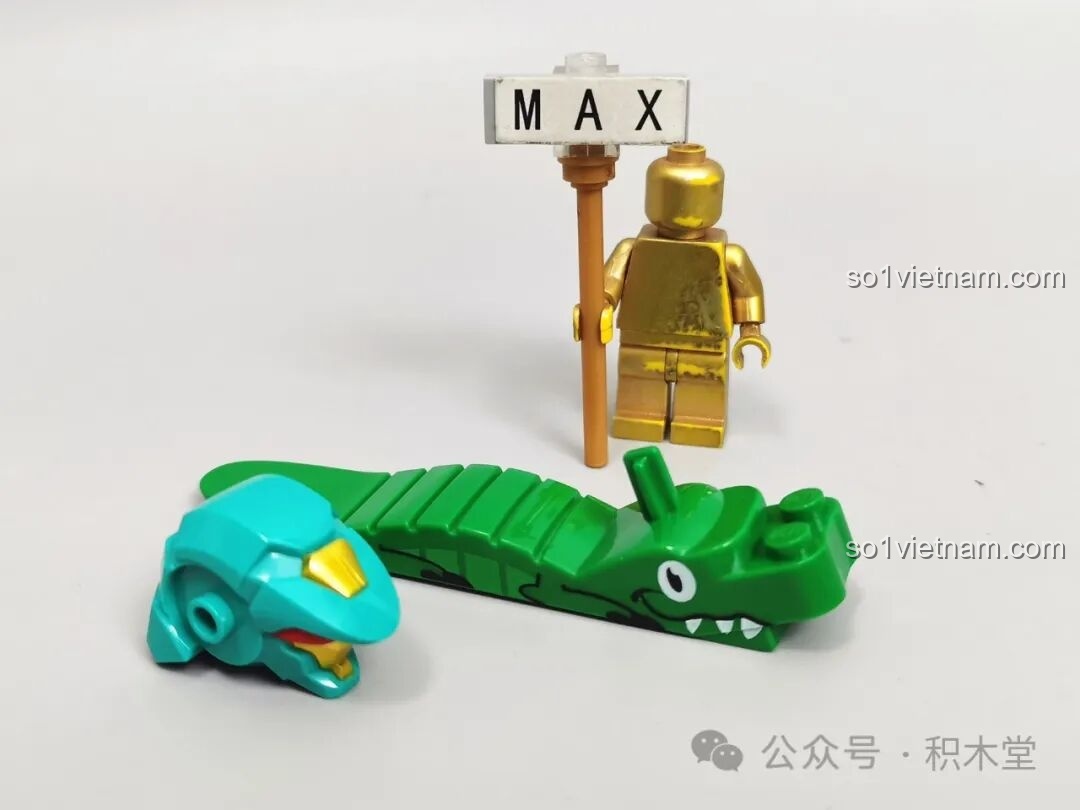 Đầu robot được đúc khuôn sẵn và dụng cụ tháo gỡ mảnh ghép hình cá sấu của Sluban M38-B1235. Thanh Long Cơ Giáp M38B1235 giá hời.