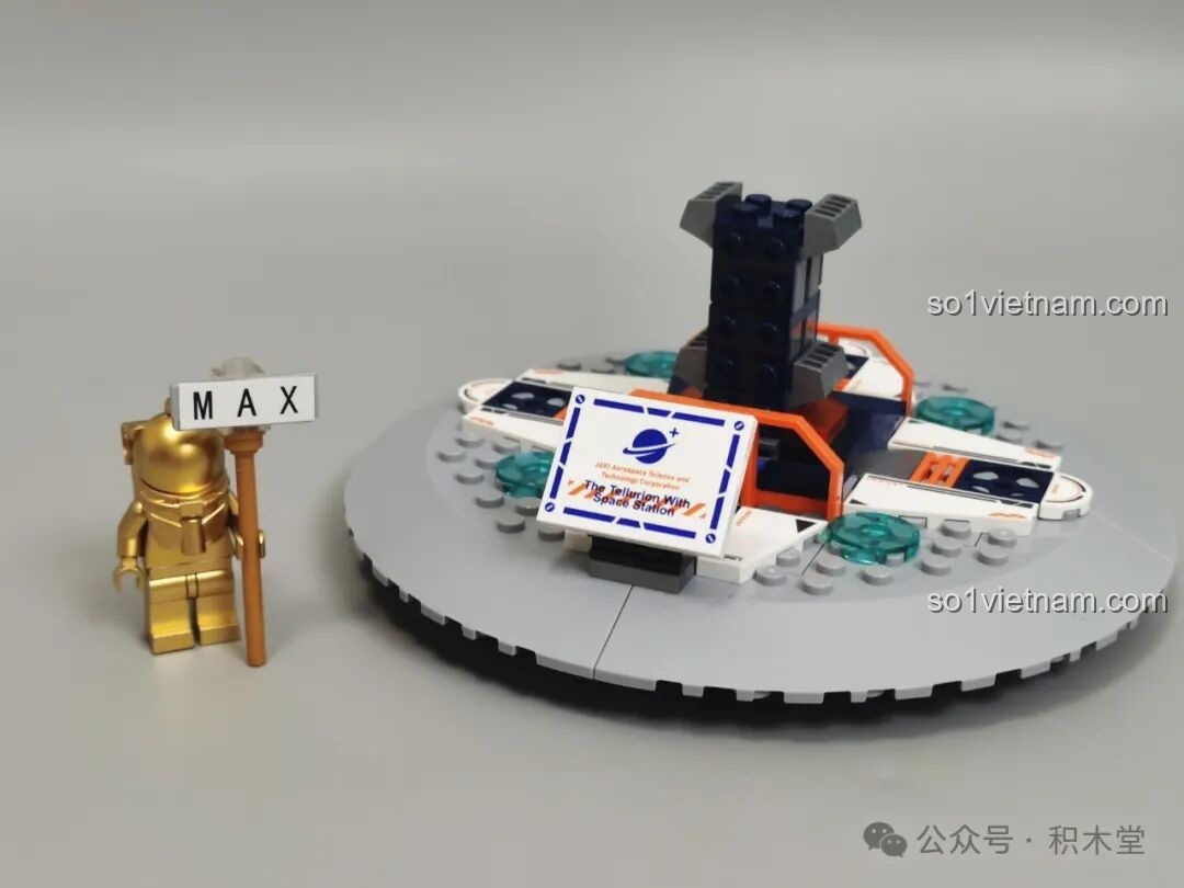 Quá trình lắp ráp phần đế của mô hình Địa cầu Bình Minh JAKI CK003, với các chi tiết màu xanh và cam nổi bật. Địa cầu Bình Minh JAKI tiết kiệm.