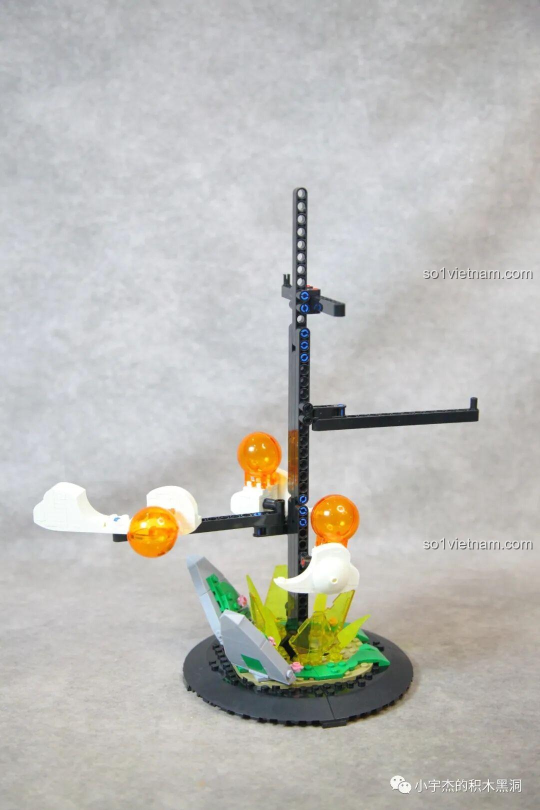 Các viên ngọc rồng và đám mây đầu tiên được gắn lên trụ đỡ của mô hình Rồng Thần DK 5007.