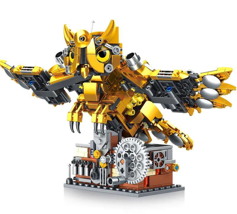 Ảnh chụp chi tiết bộ lắp ghép Cú Máy Cơ Khí GAOMISI T2102 với màu vàng gold nổi bật, phù hợp cho bé trai 6 tuổi yêu thích đồ chơi mô hình.