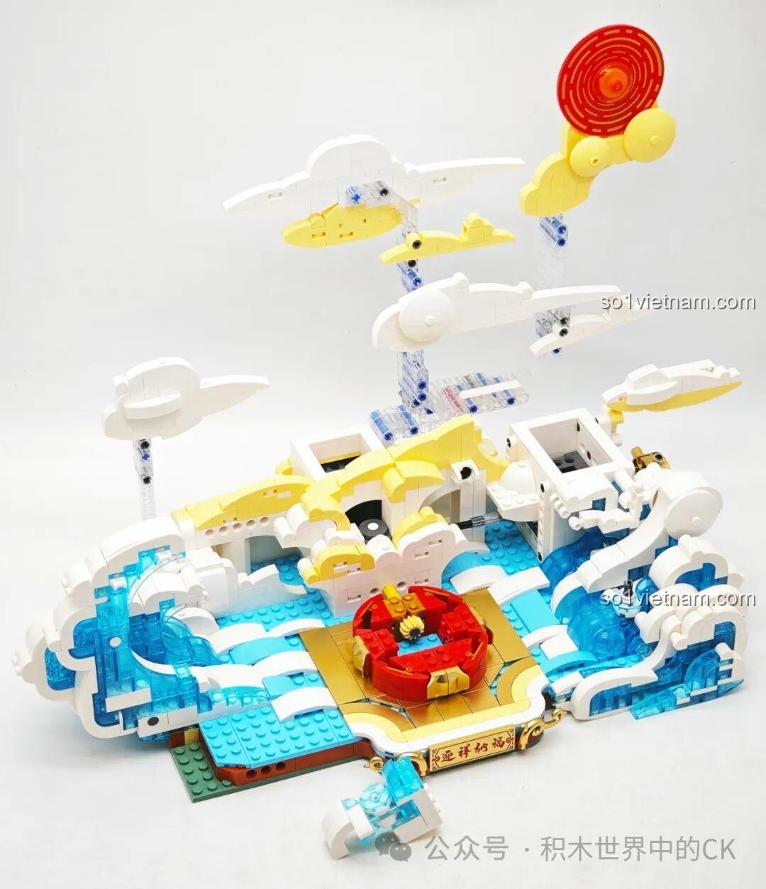 Hoàn thiện phần sóng nước bao quanh bệ trung tâm của mô hình Rồng Vàng Ôm Ngọc Keeppley K19908.