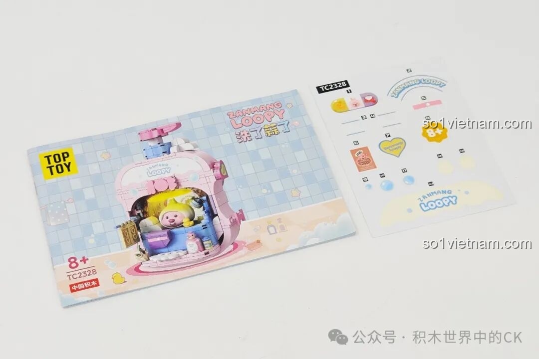 Sách hướng dẫn lắp ráp và tờ sticker đi kèm trong bộ đồ chơi TOP TOY TC2328 Bồn tắm của Loopy.