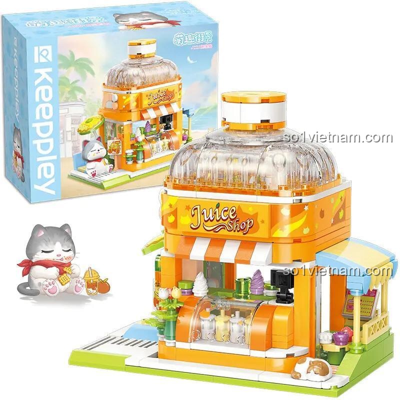 Hình ảnh bộ lắp ghép Quán nước ép Mèo Béo K 28017 bên cạnh hộp và nhân vật mèo. Đồ chơi an toàn cho bé gái 6 tuổi.
