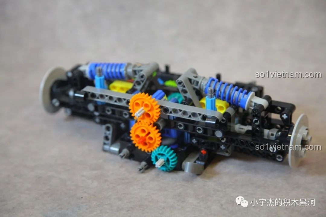 Quá trình lắp ráp hệ thống treo sau của mô hình Lamborghini SVJ K-box 10520, một bước cơ khí phức tạp.