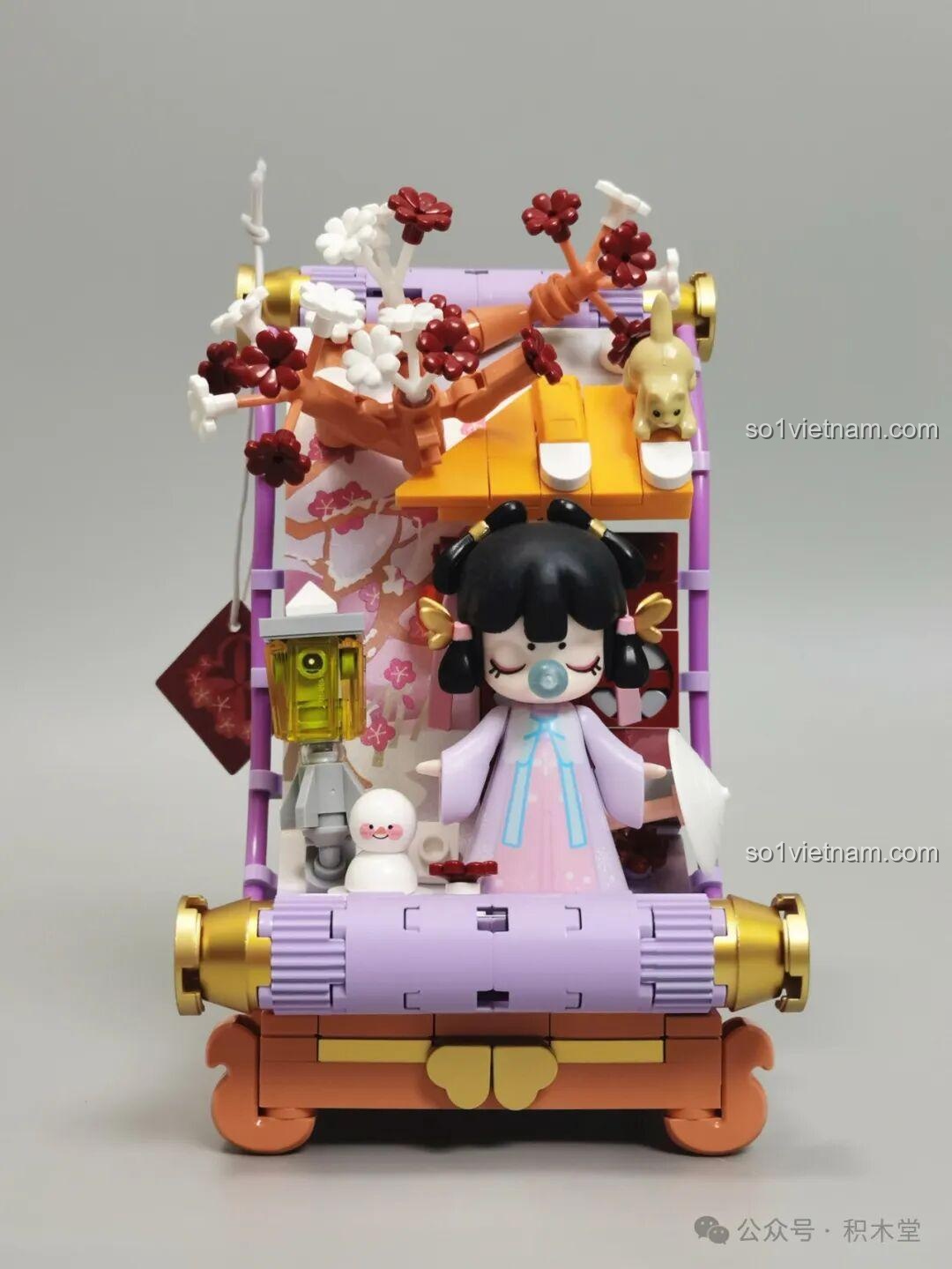 Mô hình TOP TOY Nanci mùa Đông TC2056 đã hoàn thiện, tái hiện cảnh Nanci bên người tuyết dưới mái hiên có tuyết phủ.