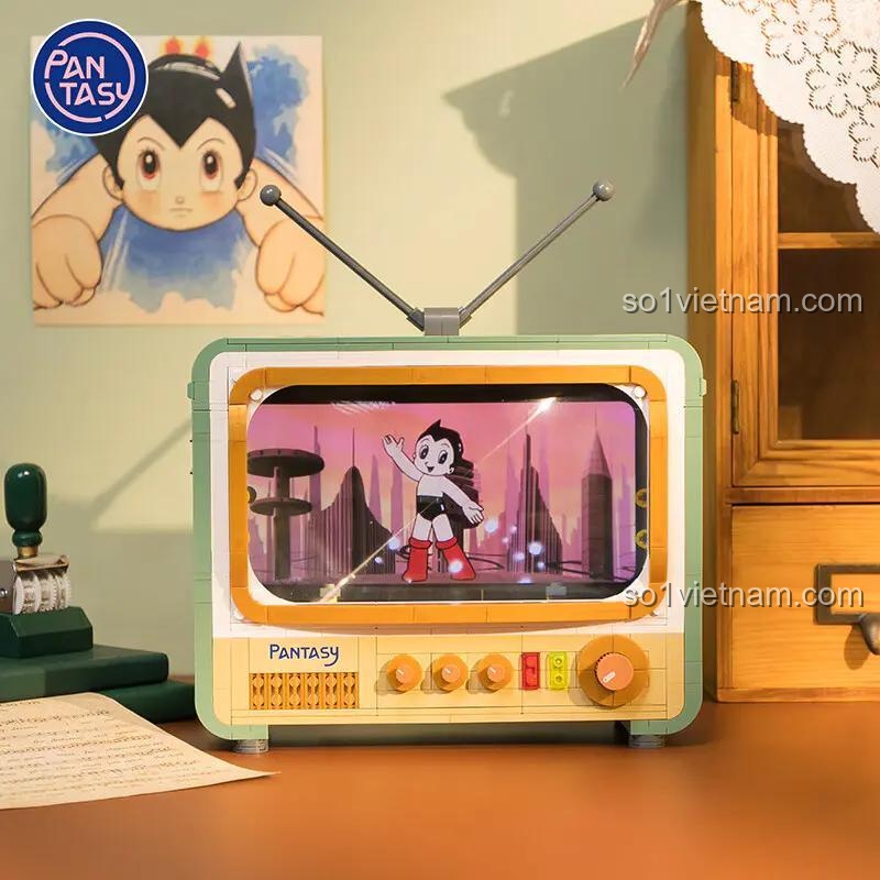 Chi tiết bộ đồ chơi 85001 hiển thị hình ảnh Astro Boy, thể hiện tính năng giá đỡ điện thoại.