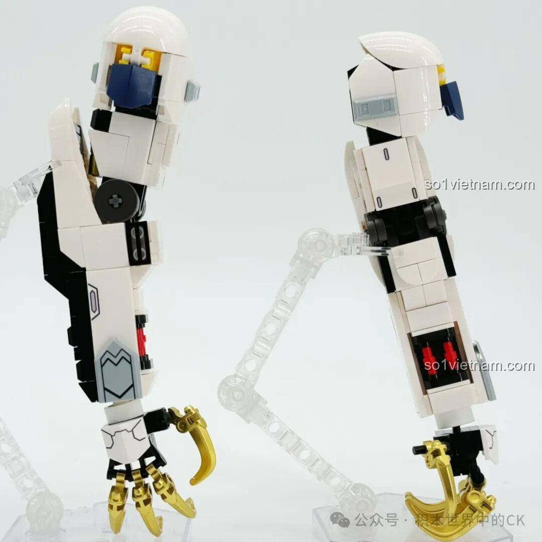 Hai cánh tay của JIESTAR 58196 Mô hình Gundam Barbatos Lupus Rex đang được lắp ráp, với chi tiết móng vuốt vàng.