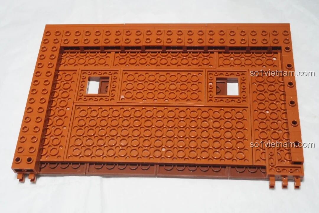 Tấm nền màu cam đang được lắp ráp của JIESTAR 89130 Tiệm Sách Ngược
