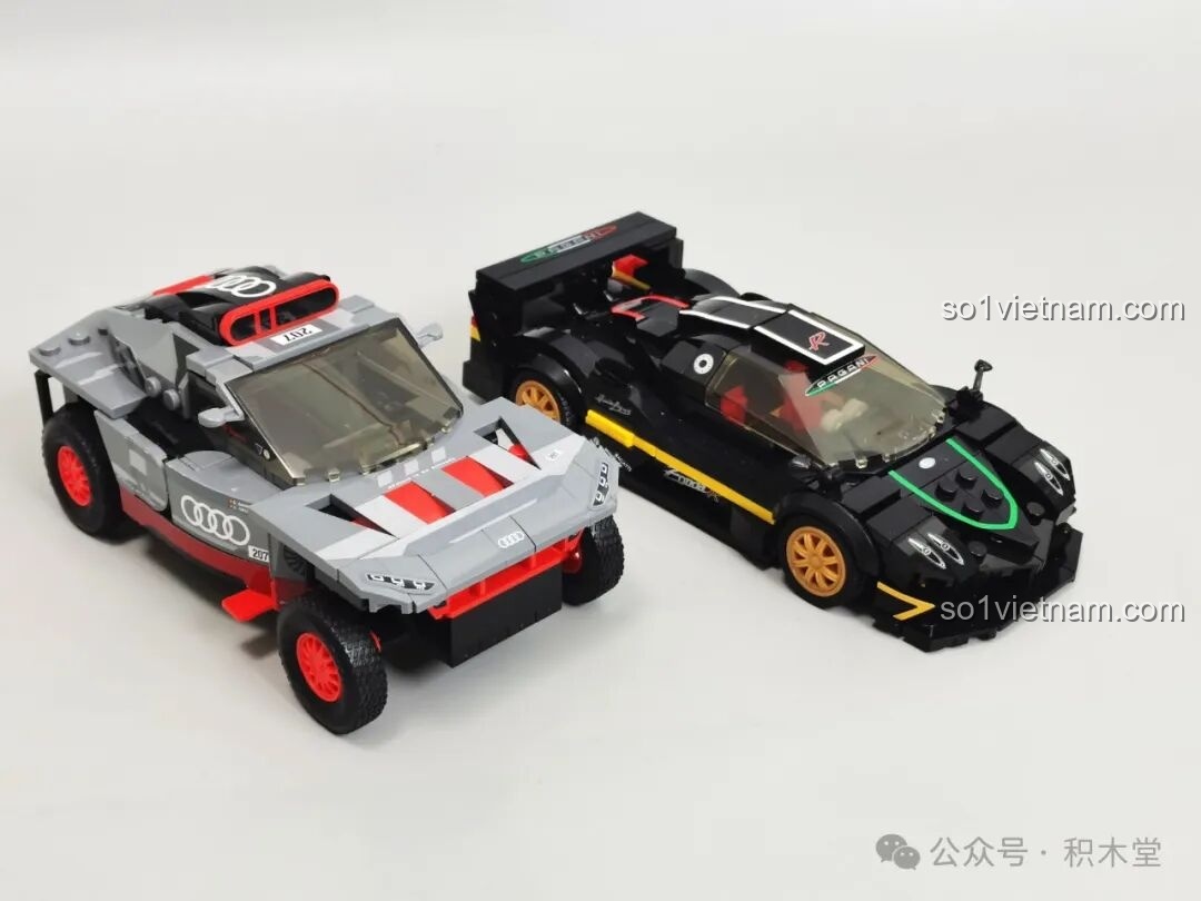 So sánh trực tiếp mô hình RASTAR 93900 Pagani Zonda R và một mô hình xe đua Audi, làm nổi bật sự khác biệt về phong cách thiết kế.