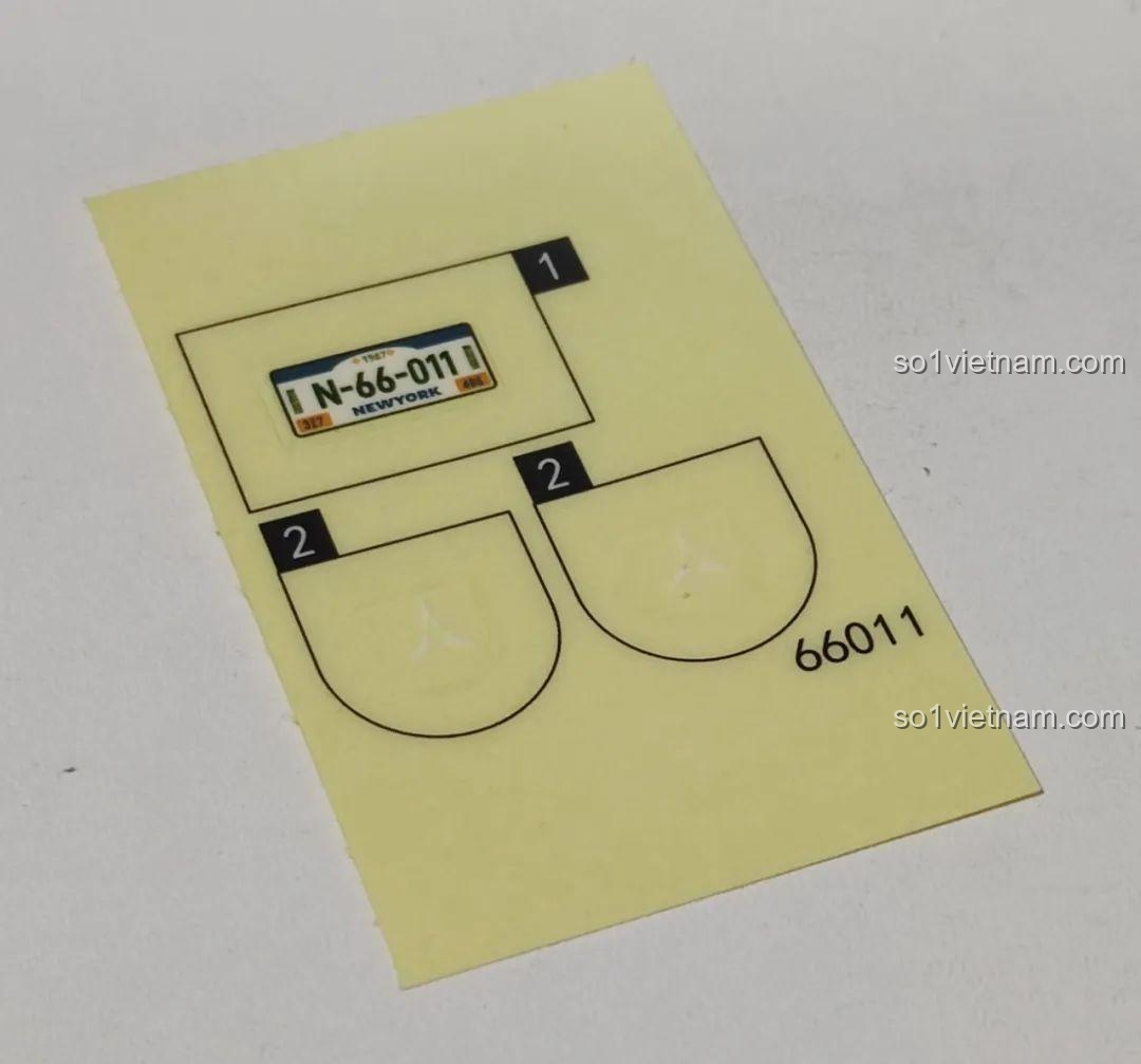 Tờ sticker đi kèm bộ lắp ghép Xbert 66011 MB RACER 4X4, bao gồm biển số xe 'N-66-011 NEWYORK' và các chi tiết trang trí khác.