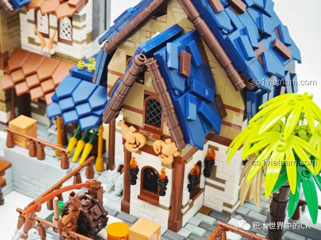 Chiếc thuyền buồm nhỏ nhắn của bộ lắp ghép JIESTAR 89152 Cảng Trung Cổ, với các chi tiết buồm và hàng hóa.