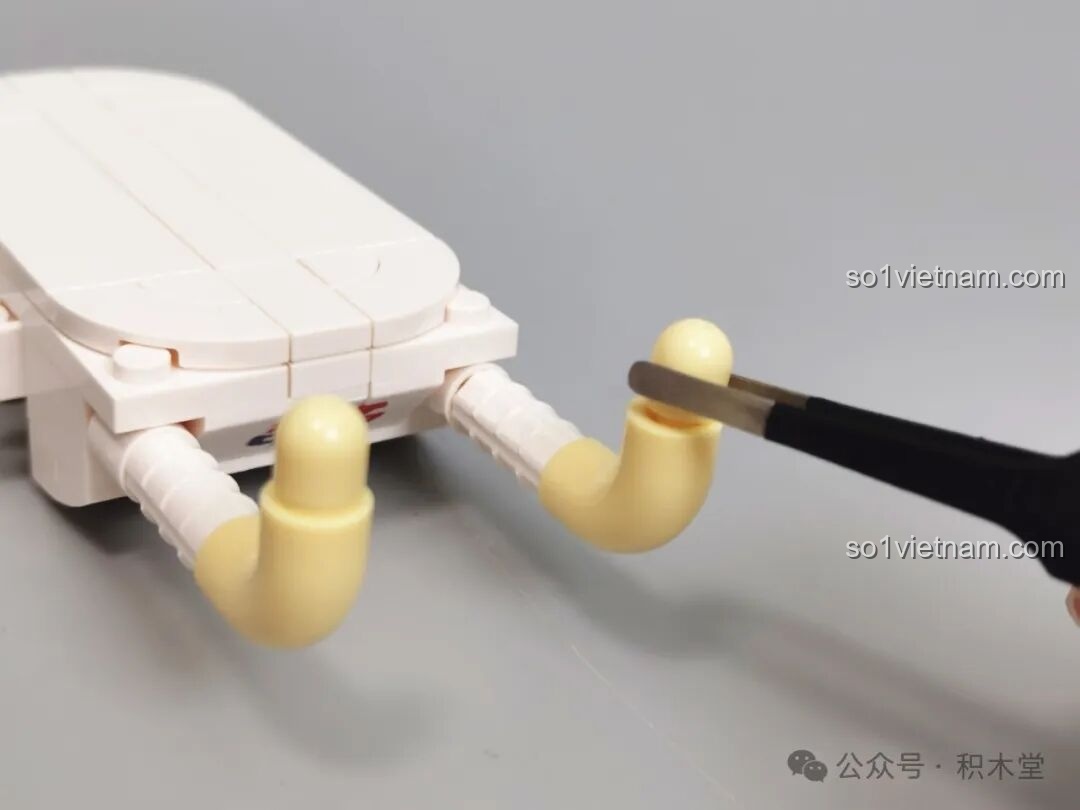 Hướng dẫn lắp ráp xe đẩy em bé Pop子 TOP TOY, có ghi chú về việc thay thế chốt ma sát.