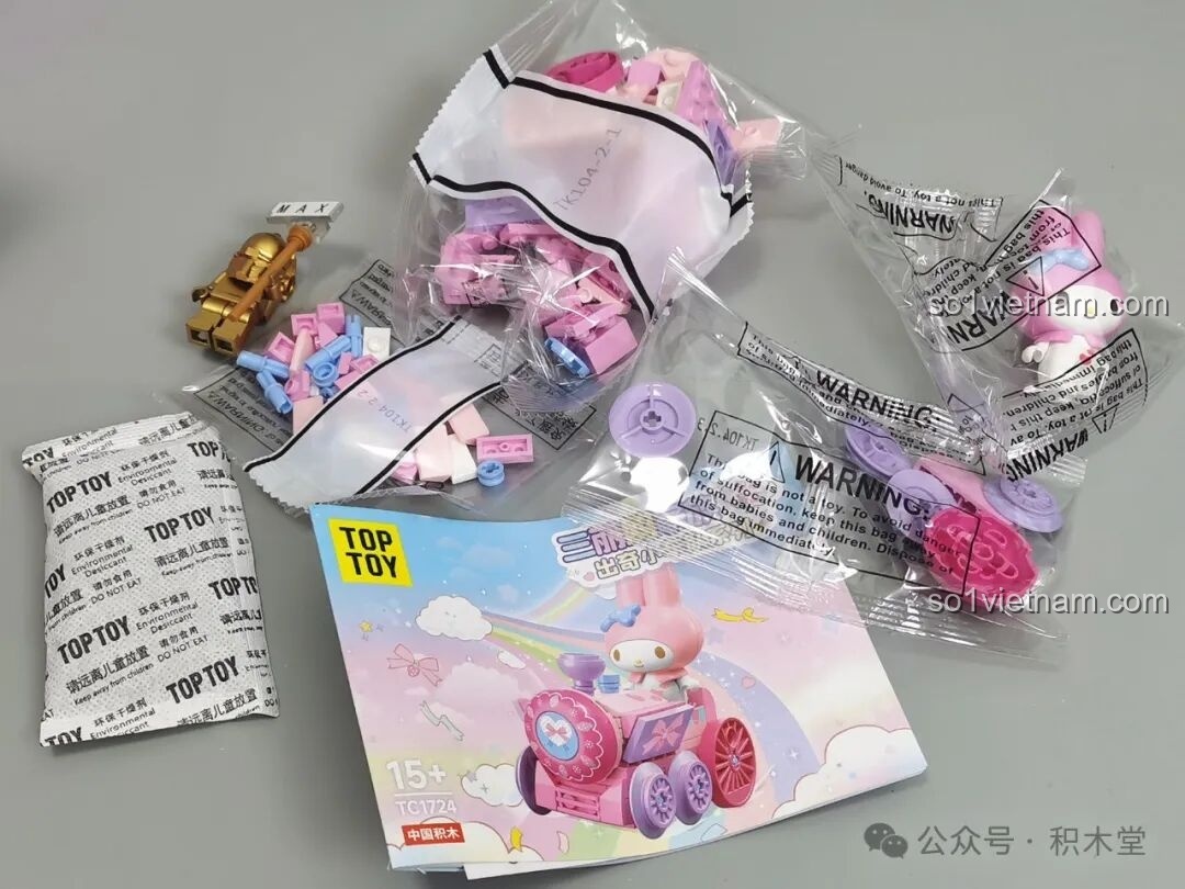 Nội dung bên trong một hộp blind box My Melody TC1724: mảnh ghép, hướng dẫn, sticker và minifigure.