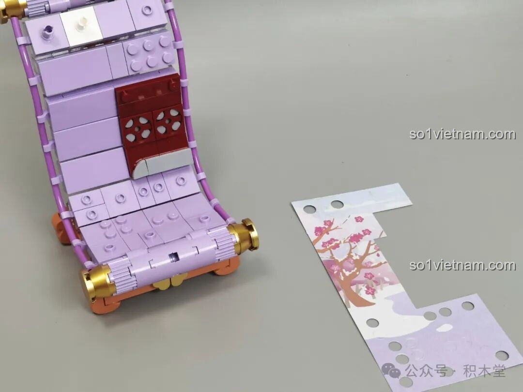 Mở hộp bộ lắp ráp TOP TOY Nanci Cuộn Tranh mùa Đông với các chi tiết màu tím và trắng.