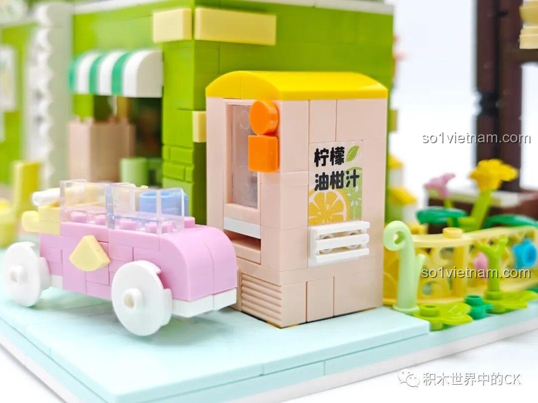 Cận cảnh máy bán nước tự động với hình ảnh chanh và chữ tiếng Trung trên bộ lắp ghép ZHEGAO 612003.