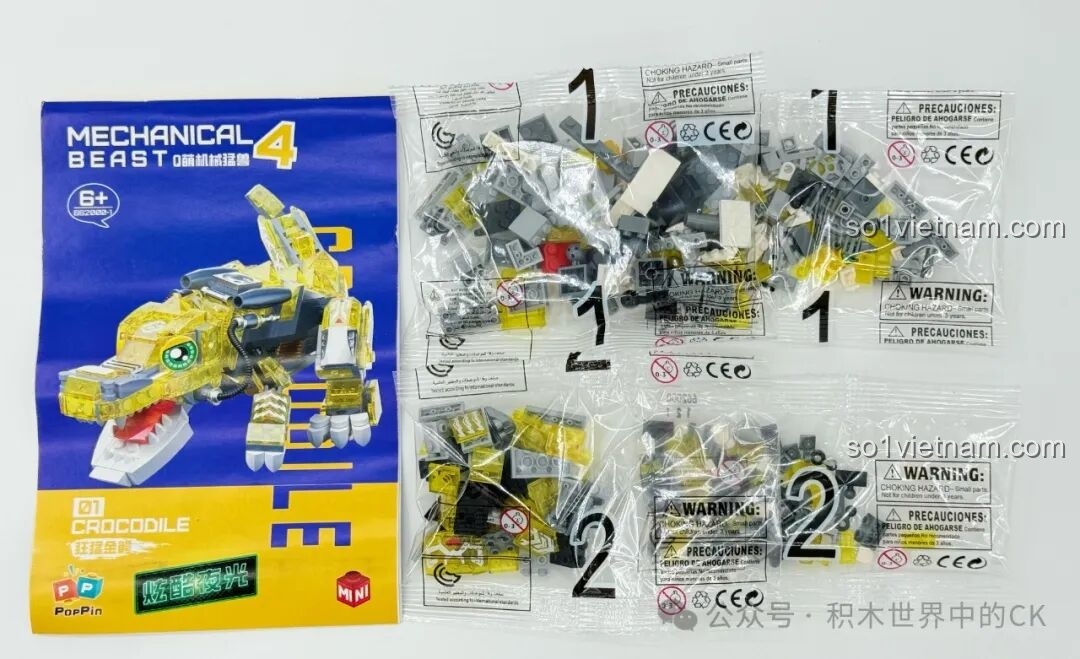 Nội dung hộp Cá Sấu Vàng Hung Tợn ZHEGAO 662000, bao gồm sách hướng dẫn và các túi mảnh ghép mini block màu vàng.